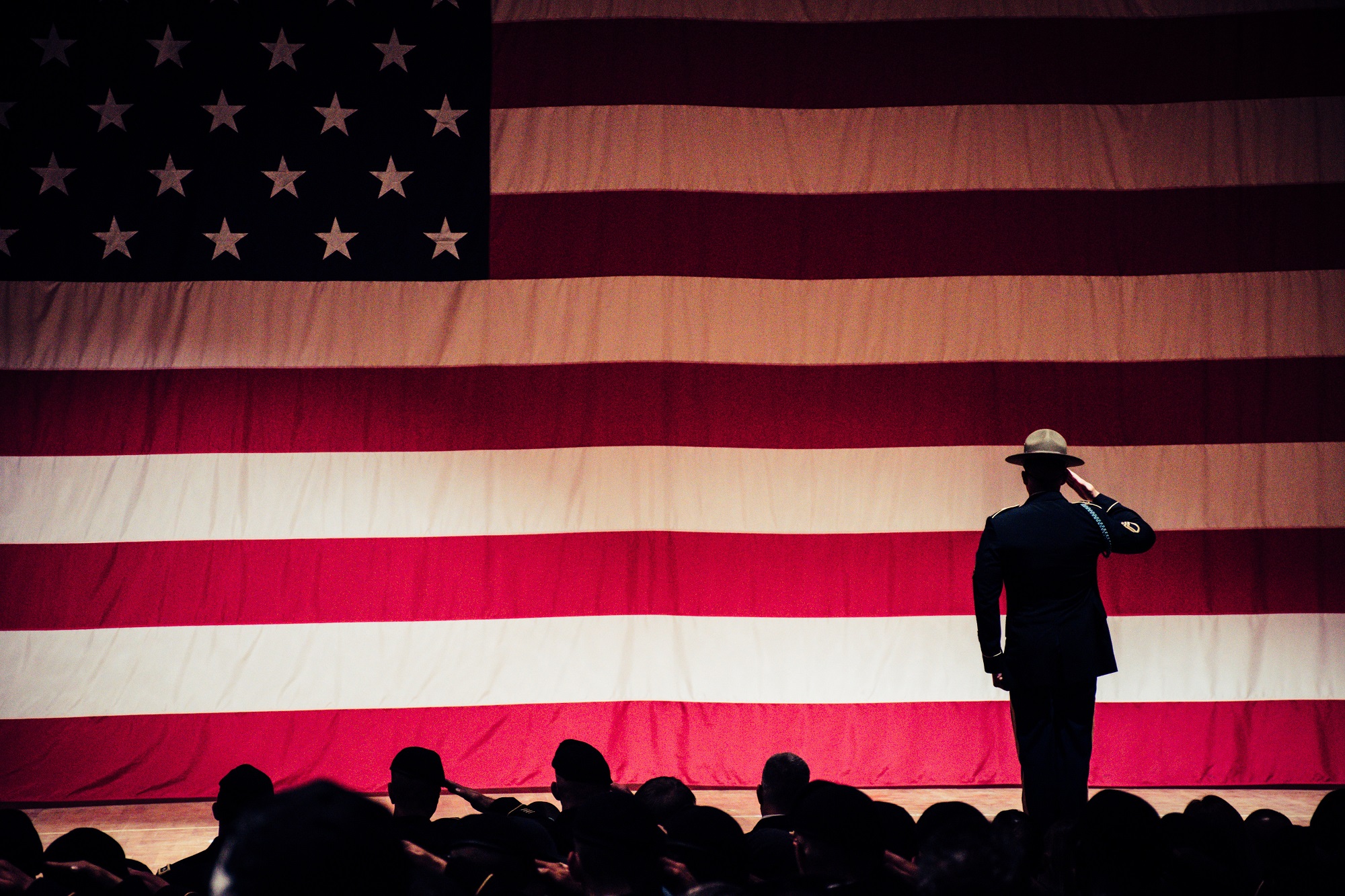 Men saluting US flag